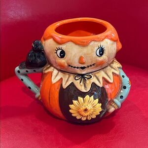 Johanna Parker Whimsical Scarecrow Ceramic Mug with Orange and Black Details